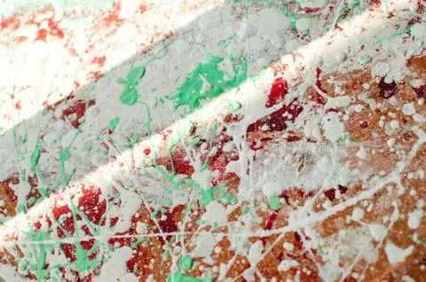 Spots and splashes of white, red and green paint on background. abstract patt Stock Photos
