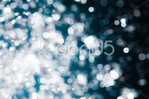 Spots Of Light Bokeh. Defocused Blue Christmas Background