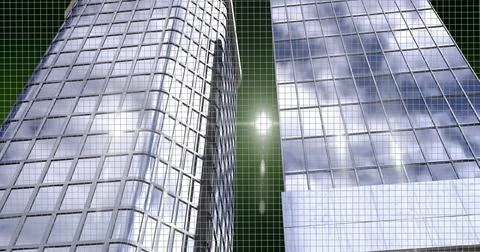 Spots of lights over two tall building models against green background Illustrazione stock