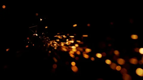 Spots of orange light fly in the dark Stock Footage 91396007