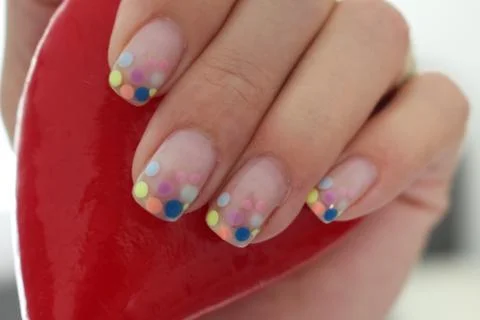 Spotted cheerful nails Stock Photos