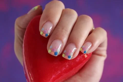Spotted cheerful nails Stock Photos