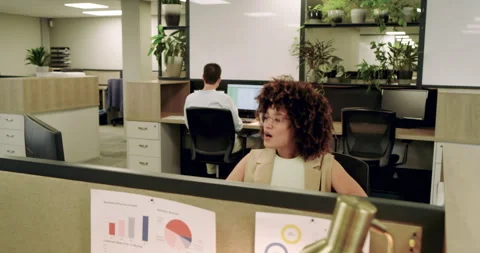 Spotting chart error on monitors, diverse coworkers stretching and discussing Stock Footage 314535953