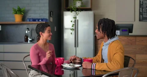 Spotting empty plate waitress moving toward Diverse couple placing croissant Stock Footage 337624237
