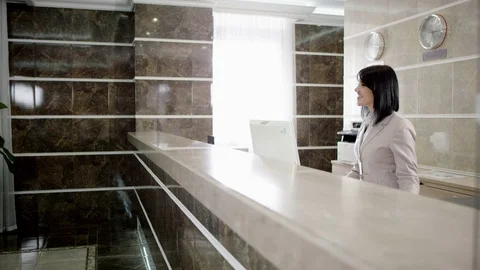 Spouses check in appartment in hotel Stock Footage 74286884