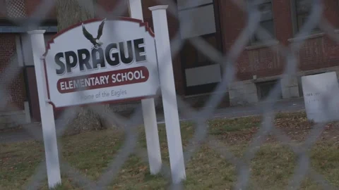 Sprague Elementary School Sign through chain link fence Stock Footage 304373109