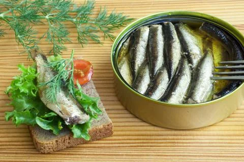 Sprats and tomatoes on a table Foto stock