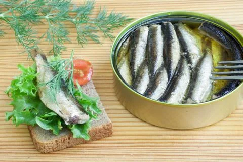 Sprats and tomatoes on a table Foto stock