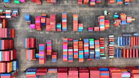 A sprawling container yard, bustling with activity. Video stock 249728710
