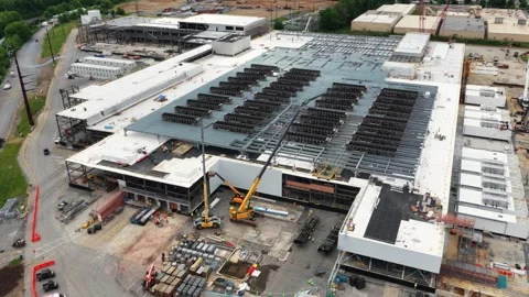 Sprawling data center in Lancaster shows dense rooftop cooling arrays, multiple Stock Footage 337978494