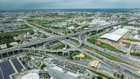 Sprawling Highway Interchange Weaving Through Bangkok Urban Landscape High .. Stock Photos