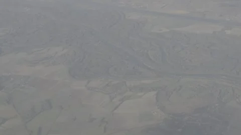 Sprawling landscape in total from the sky 4K log format Stock Footage 255208276