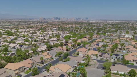 Sprawling Las Vegas Suburb Featuring Terracotta Roofs and Distant City Skyline Stock-Footage 333226654