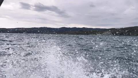 Spray from a boat that sails fast on the waves Stock Footage 260003622