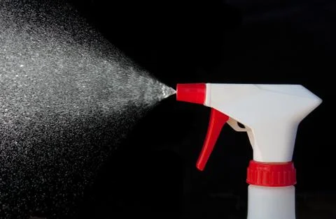 Spray bottle in action Stock Photos