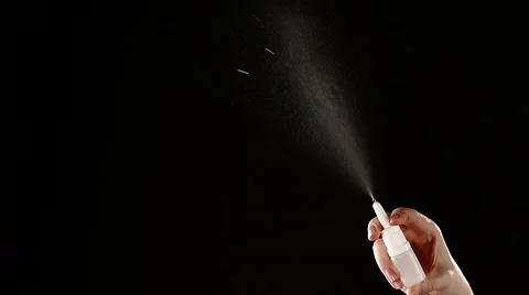 Spray bottle drops on black, slow motion Stock Footage 56558059