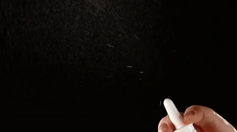 Spray bottle drops on black, slow motion, close up Stock Footage 56567496