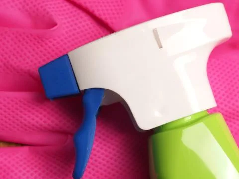 Spray bottle on gloves Stock Photos