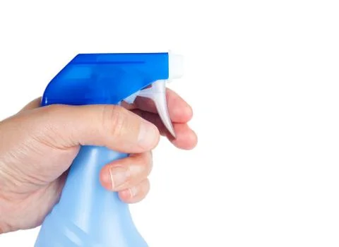 Spray bottle in a hand Stock Photos