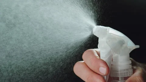 Spray bottle moisture slow motion Stock Footage 158124460