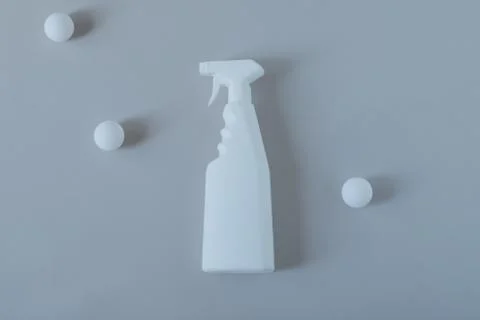 Spray cleaner on a gray background Stock Photos