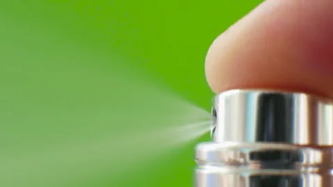 Spray diffuser of aroma, Eau de toilette puff on a green background. Chroma Key Stock Footage 249328301