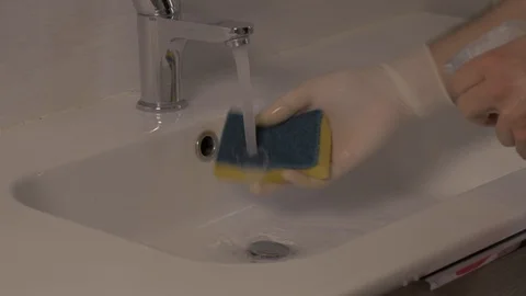Spray disinfectant on a sponge for deep cleaning Stock Footage 125432185