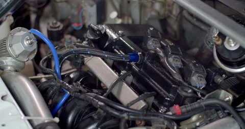 Spray the engine compartment with cleaning spray.Engine compartment cleaning. Stock Footage 282695037