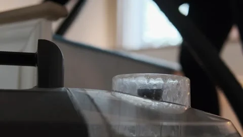 Spray extraction cleaner machine in foreground during professional mattress Stock Footage 309102459