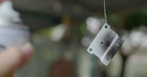 Spray the first layer of black paint after the primer. Stock Footage 310748753