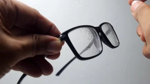 Spray the glasses with cleaning fluid Stock Footage 324446521