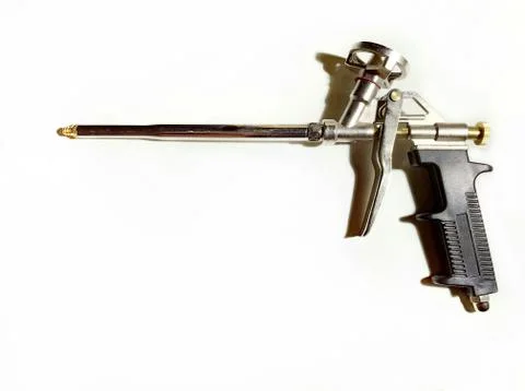 Spray gun for mounting foam isolated on white background. Stock Photos