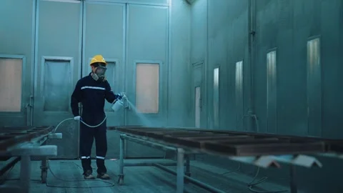 Spray painter wearing protective equipment working in a factory Stock Footage 266224097