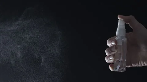 The spray puffs out a stream of liquid. Antiseptic drops. Aerosol..  Stock Footage 145790998