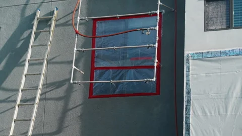 Spray Rack Apparatus Attached To A Building Exterior Wall For Window Water Vídeos de archivo 346195522