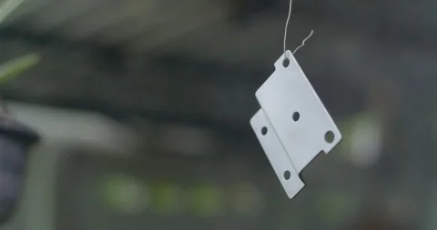 Spray the second layer of primer.A painting technician paints a part of a car. Stock Footage 310748708