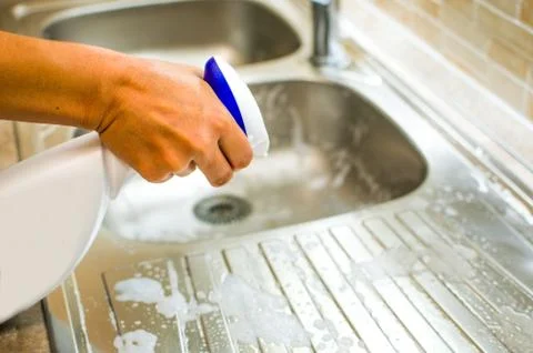 Spray on sink Stock Photos