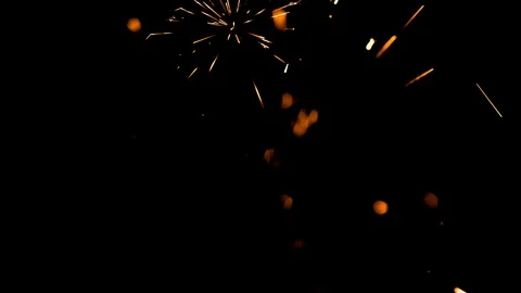Spray of sparks on black background Stock Footage 121636184