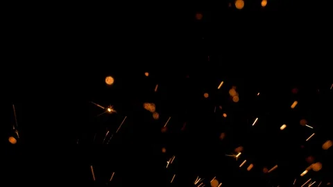 Spray of sparks on black background Stock Footage 121636314