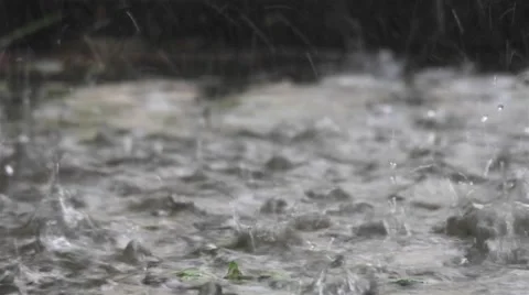 Spray water puddle jumping in the middle of the court while torrential raining Stock Footage 64351621