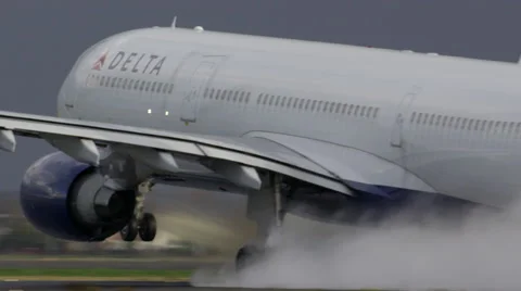 Spray from a wet runway during takeoff Stock Footage 42680337