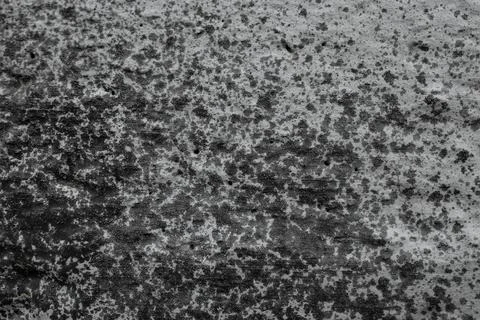 Sprayed black paint on gray cement wall, abstract textured effect backdrop Stock Photos