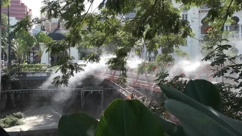 Sprayed mist over River of Life near Masjid Jamek in Kuala Lumpur Stock Footage 195201829