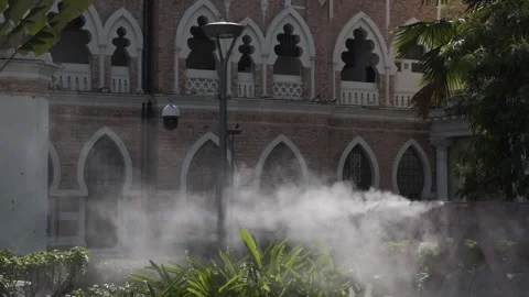 Sprayed mist over River of Life near Masjid Jamek in Kuala Lumpur Stock Footage 195202166