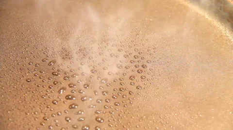 Sprayed oil  boiling on the hot pan 1 Stock Footage 43570912