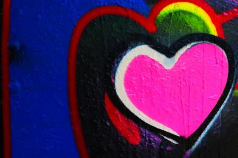 Sprayed wall texture with pink hearth Stock Photos