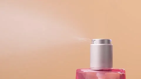 Sprayer button of cosmetics bottle is pressed, slow motion. Pressing button.. Stock Footage 297679062
