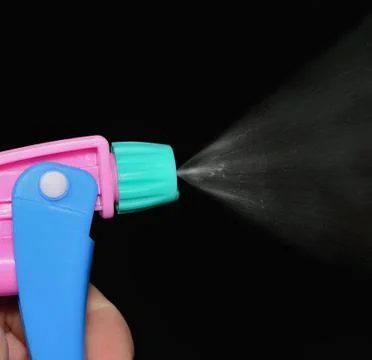 The sprayer on a dark background 스톡 사진