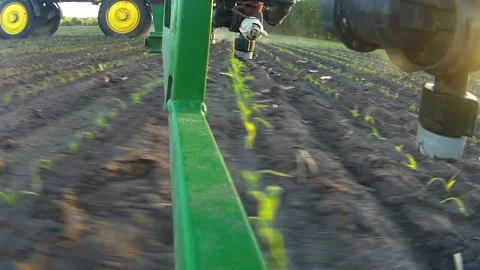 Sprayer nozzle in operation, tractor sprayer works in the field. Stock Footage 93081071
