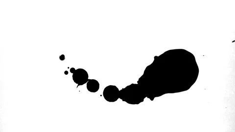 Spraying black paint on a white background Stock Footage 303171566